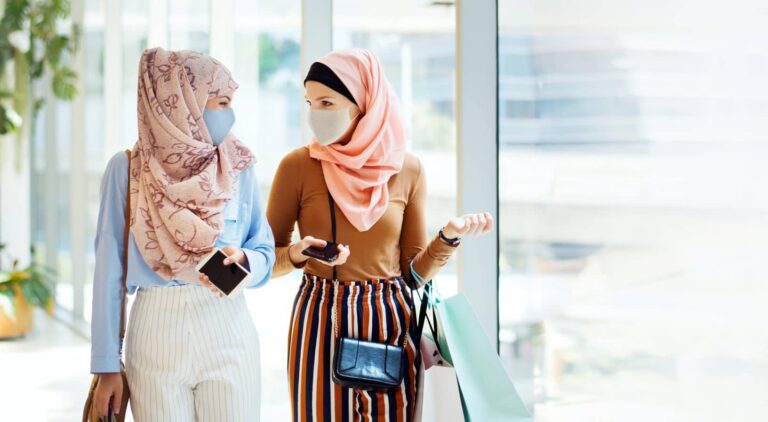 New immigrants are stitching masks that can be worn comfortably with a hijab